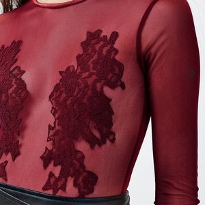 Sheer bodysuit with lace appliqué